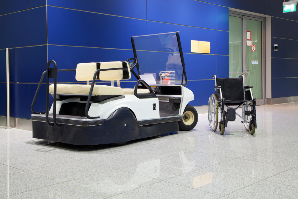 Wheelchair and buggy in airport terminal