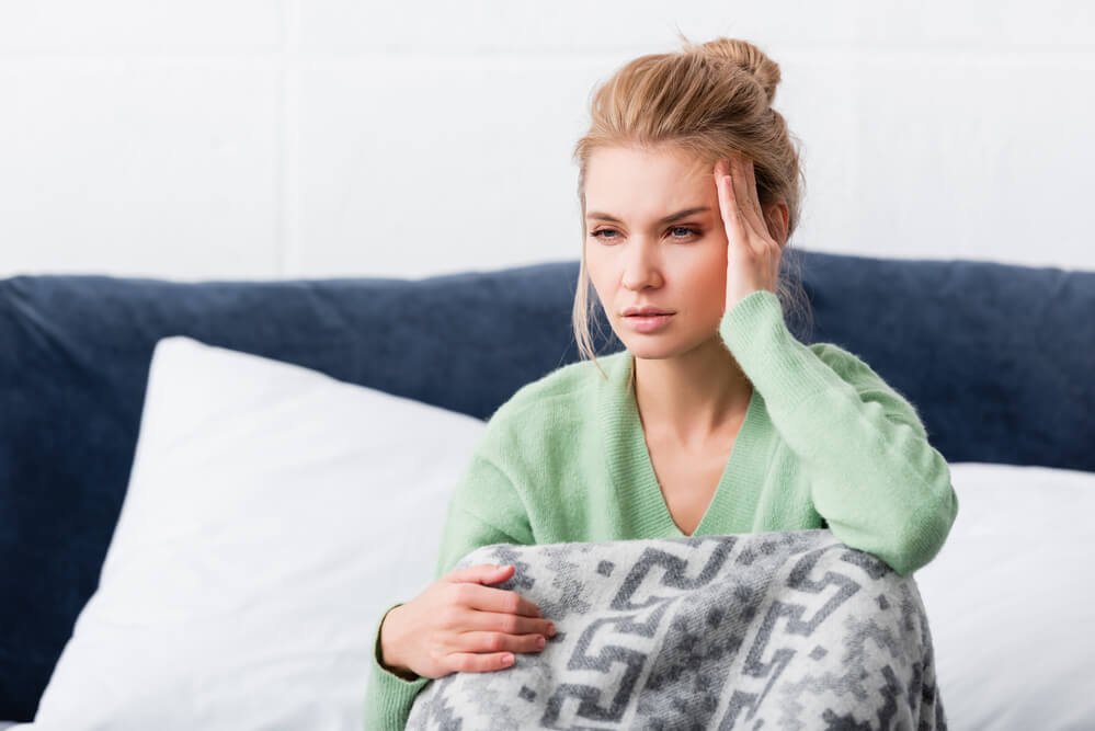 a tired woman in bed